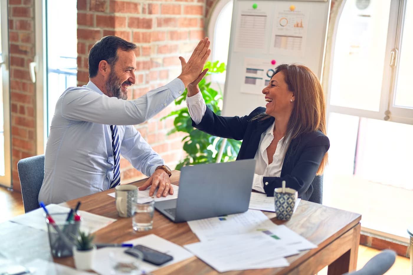 Advisors reviewing retirement scenarios with a CPA client